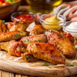 Grilled,Chicken,Wings,With,Ketchup,And,Mustard,Sauces,On,A